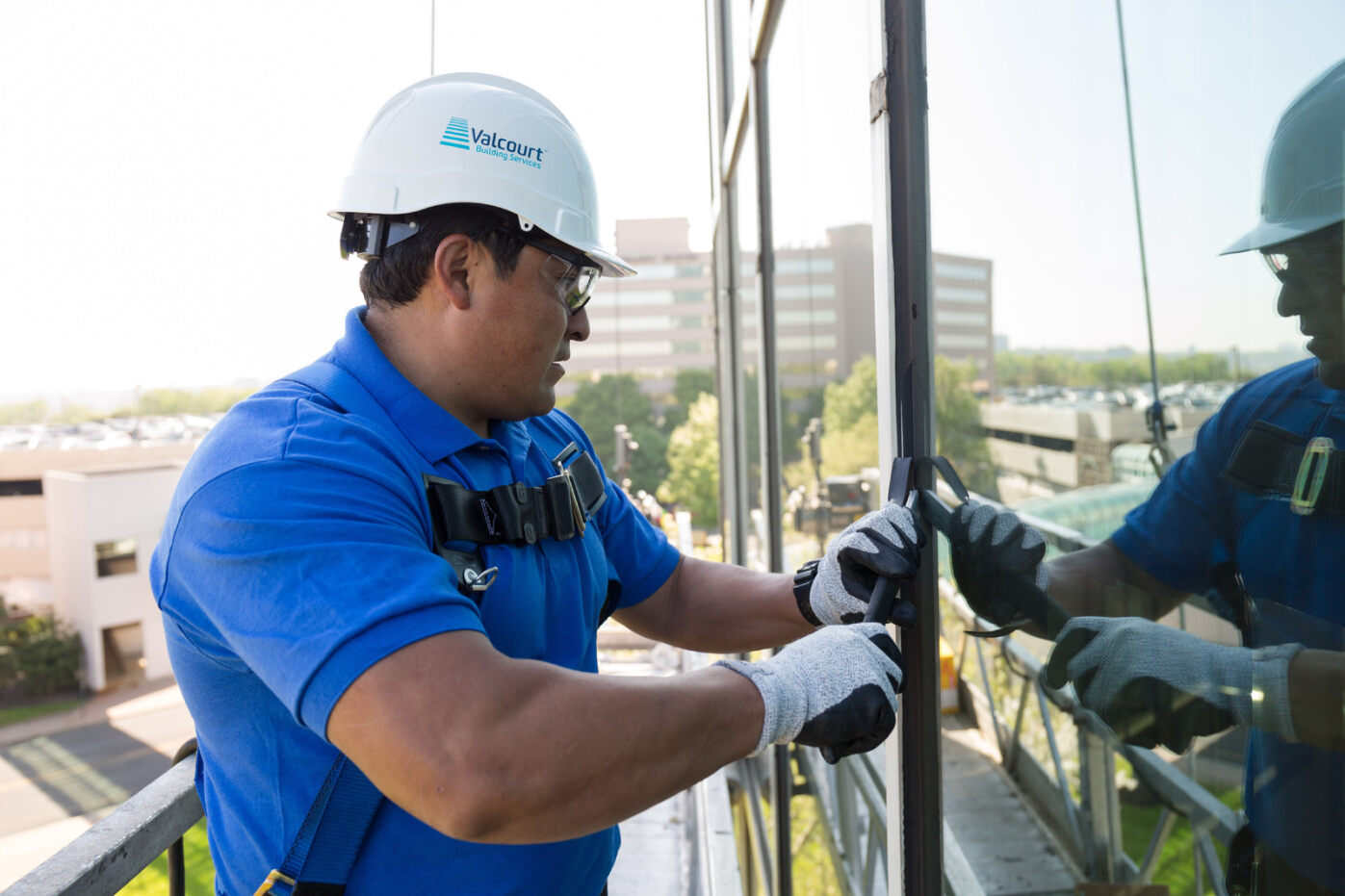 waterproofing technician repairing on building facade